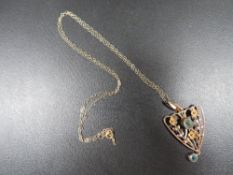 An antique 9ct gold pendant & chain
