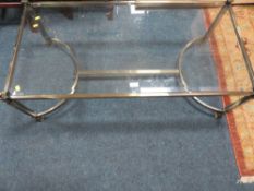 A modern brass & glass coffee table