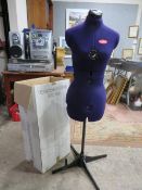 A boxed adjustable mannequin