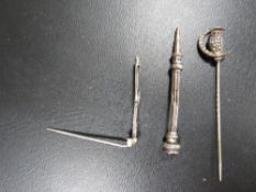 A hallmarked silver miniature propelling pencil, seed pearl silver stick pin in the form of an owl