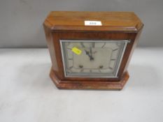 A walnut cased cased Garrard mantle clock