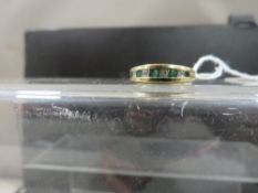 A hallmarked 9ct gold ring set with diamonds and emeralds, size L, weight approx 2.2 g