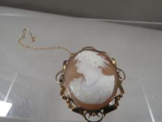 A Victorian shell cameo brooch marked 9ct