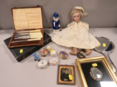 A tray of antique and other collectables to include a doll, hallmarked silver hand mirror, Halcyon