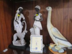 Two decorative figures of ladies with dogs together with a goose A/F