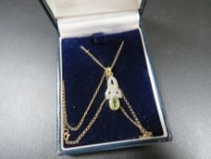 A hallmarked 9ct gold diamond & peridot necklace
