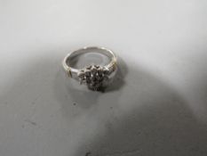 A hallmarked 9ct white gold diamond cluster ring size L, weight approx 2.4 g