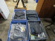 A selection of motorcycle equipment to include boxed boots, coats, gloves and waxed type bodywarmers