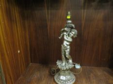 A silver gilt effect table cherub lamp