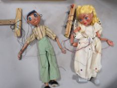 A vintage boxed Pelham puppet plus another