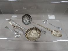 Five assorted hallmarked silver spoons to include a swirl pattern sifter example, a hallmarked