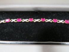 A hallmarked 9 carat gold ruby and diamond bracelet approx. weight 4.1g