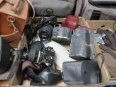 Three trays of cameras, equipment and accessories to include Nikon