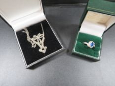 A vintage silver marcasite necklace together with a silver ring