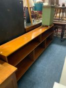 A large low open mid century teak open bookcase L 214 cm together with a linen box. (2)