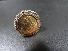 A hallmarked 9 carat gold mounted half sovereign ring dated 1907 approx. overall weight 8.9g
