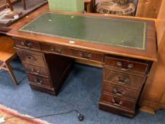 A leather topped twin pedestal desk