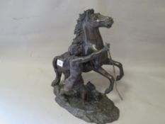 A spelter style figure of a man on a horse