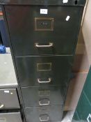 A vintage green 4 drawer filing cabinet