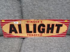 A vintage metal advertising sign for Ringers A1 Light Tobacco