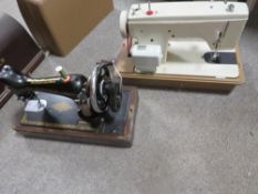 A cased Singer sewing machine together with a cased Winfield example