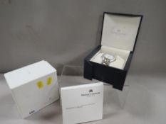 A Maurice Lacroix wrist watch together with box and paper work with guarantee dated 2000