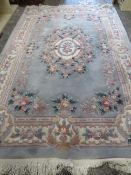 A large modern Chinese woollen rug 274 x 185 cm