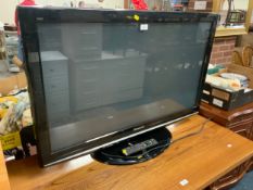 A Panasonic 41” flatscreen television with remote