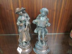 Four cast metal figures