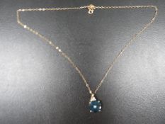 A gem set pendant on a 9kt chain approx. weight 1.8g