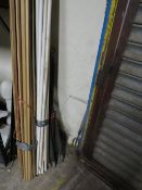 A selection of wooden trim, PVA waste pipe and drain cleaning rods