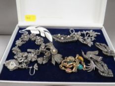 A tray of assorted silver and white metal jewellery to include marcasite example