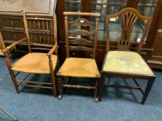 Two vintage oak wicker seat chairs and a 19th mahogany chair. (3)