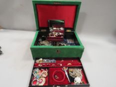 A jewellery box containing a quantity of costume jewellery