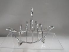 A hallmarked silver wire work four division boat shape toast rack