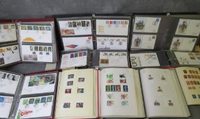 SIX FIRST DAY COVER ALBUMS, together with four British stamp albums, one of which contains many