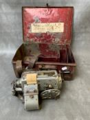 A VINTAGE BUS CONDUCTORS TICKET MACHINE, in a metal case