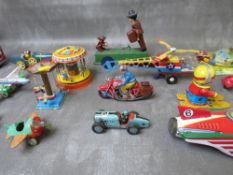 A TRAY OF MAINLY TIN PLATE TOYS, to include an early American military vehicle, bus, plane, rocket