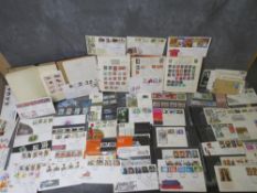 THREE STAMP ALBUMS CONTAINING WORLD STAMPS, together with a collection of first day covers mainly