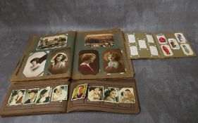 AN ALBUM OF VINTAGE POSTCARDS, an album of vintage cigarette cards (sportsmen, actors / actresses