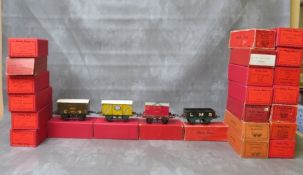 TWENTY FOUR BOXED HORNBY O GAUGE ROLLING STOCK, to include tank wagon, brake van, low sided wagon PO