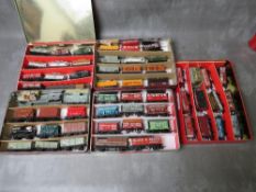 FIFTY EIGHT PIECES OF OO GAUGE ROLLING STOCK, all unboxed to include tankers, covered / uncovered