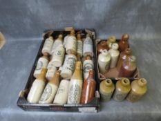 TWO TRAYS OF STONEWARE ADVERTISING BOTTLES, (28)