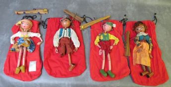 FOUR UNBOXED PELHAM PUPPETS, to include Tyrolean boy / girl and cowboy / girl, all in red puppet