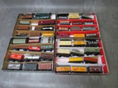 FORTY FIVE PIECES OF OO GAUGE ROLLING STOCK, comprising three tankers andtn covered wagons