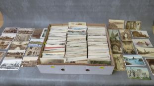 A TRAY OF VINTAGE POSTCARDS TO INCLUDE MANY 1920s EXAMPLES, with views of churches, cathedrals etc