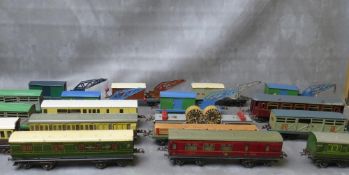 NINETEEN UNBOXED PIECES OF O GAUGE ROLLING STOCK, to include six ten ton crane trucks, carriages,