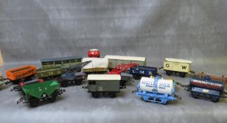 SEVENTEEN UNBOXED PIECES OF O GAUGE ROLLING STOCK, mainly Hornby, to include cranes, tankers,