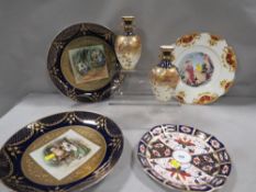 A pair of Royal Crown Derby twin handled vases A/F together with four decorative plates to include a