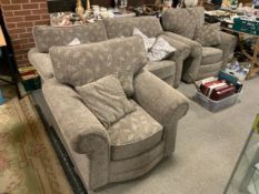 A modern three piece upholstered suite